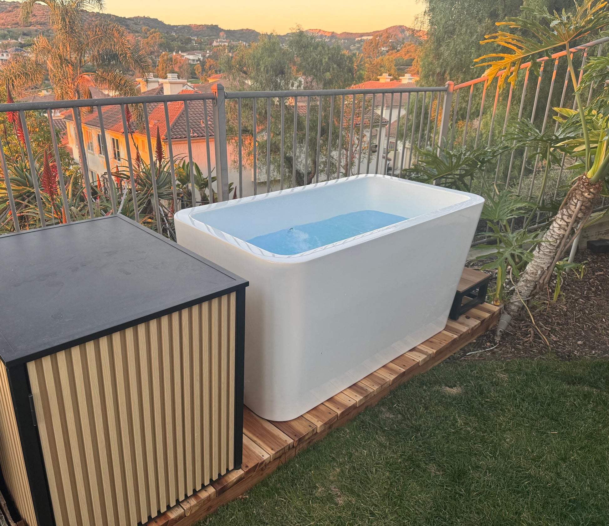White cold plunge tub in outdoor setting alternate image