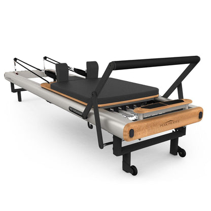 Pilates reformer machine on a white background