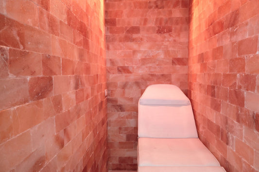 Lounge chair in a pink himalayan salt therapy room